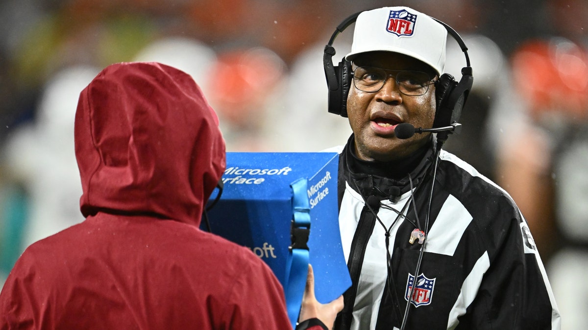 Referee Ron Torbert and other NFL officials will get more help from the replay booth, beginning with the 2025 regular season. (Jason Miller/Getty Images)