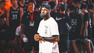 LEBRON JAMES Trending Image: LeBron James Helping Lakers In Film Study While He's Sidelined With Sciatica