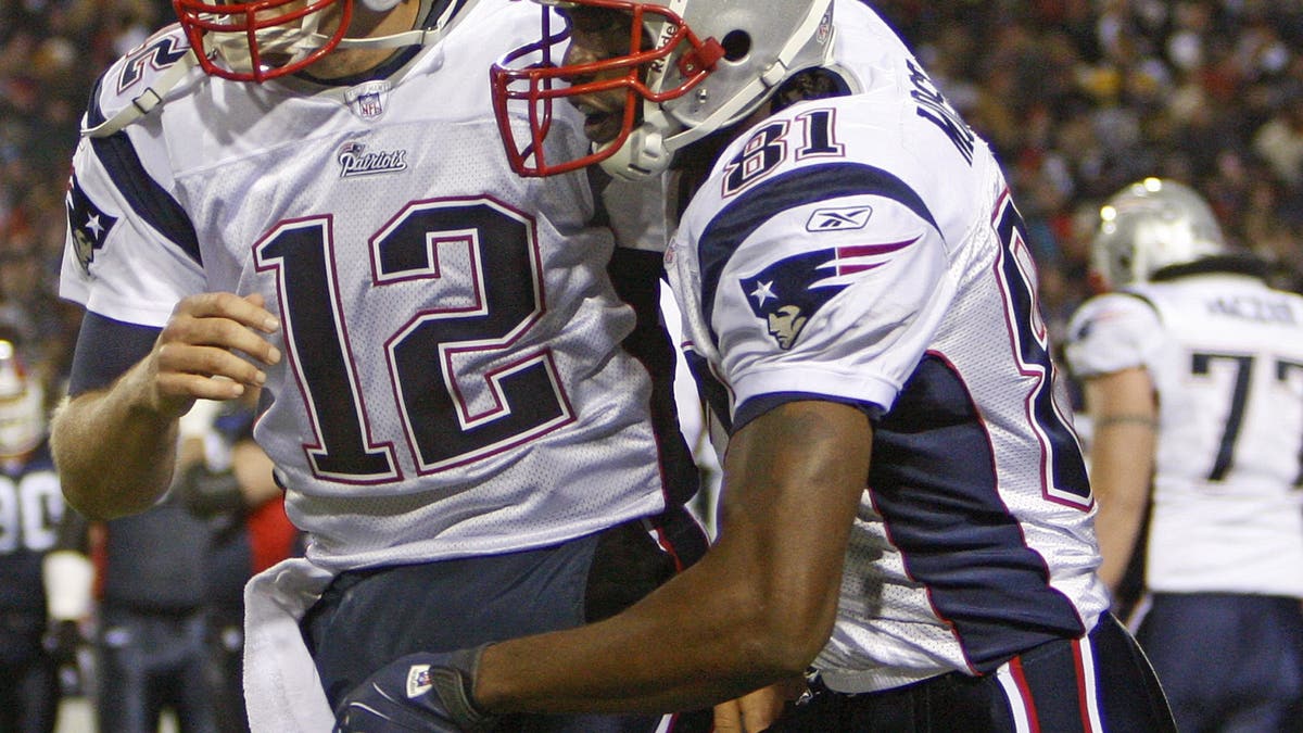 Tom Brady connected with Randy Moss for four touchdowns in the Patriots' win over the Bills in November 2007, with New England scoring a touchdown on all eight drives Brady played in. (Icon Sportswire/Getty Images)