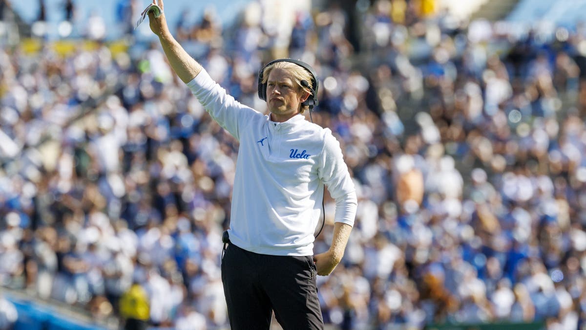 UCLA offensive coordinator Jerry Neuheisel calls a play late in the game against Penn State.(Gina Ferazzi / Los Angeles Times via Getty Images)