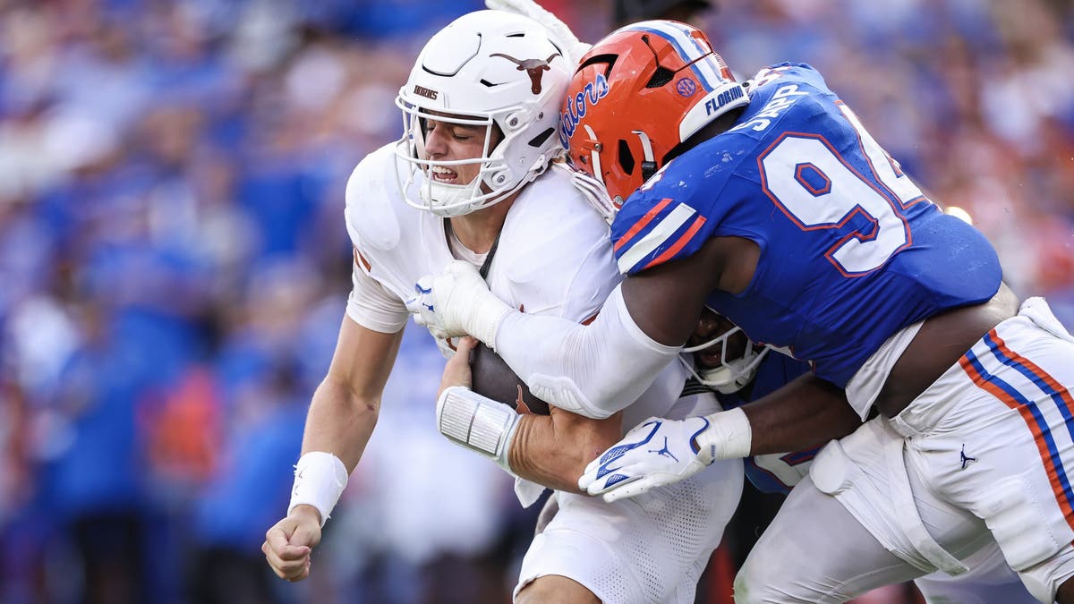 Arch Manning was sacked six times in Texas' loss to Florida. (Photo by James Gilbert/Getty Images)