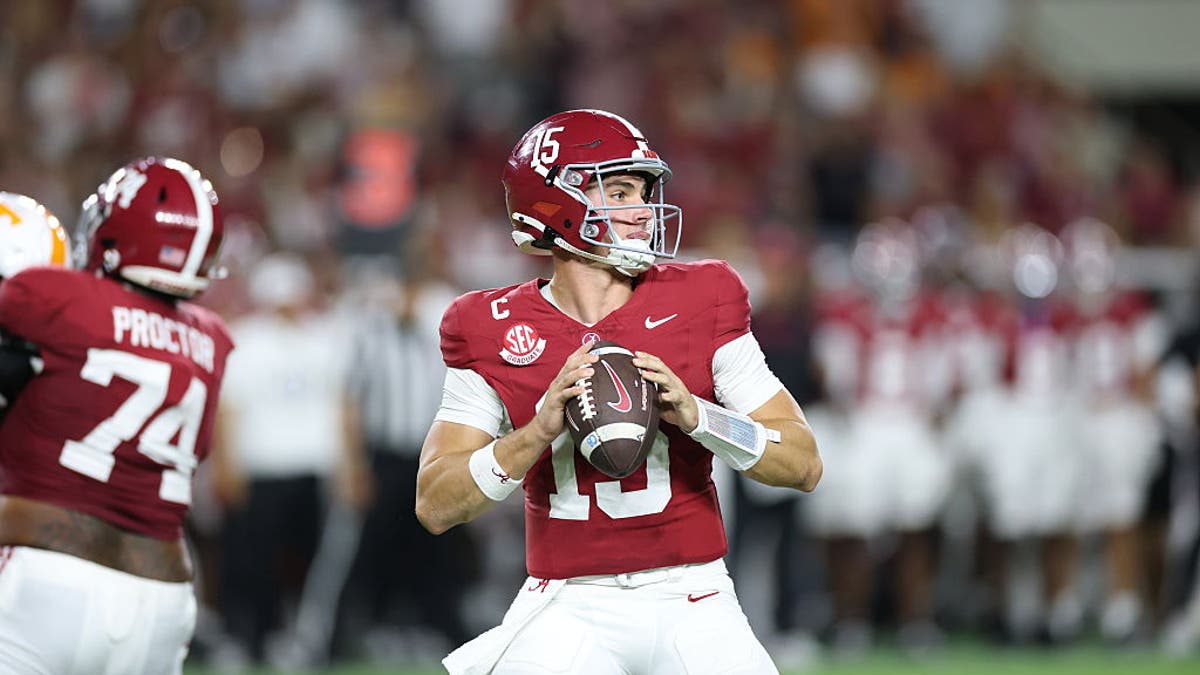 Ty Simpson #15 of the Alabama Crimson Tide looks to pass against the Tennessee Volunteers. (Photo by Kevin C. Cox/Getty Images)