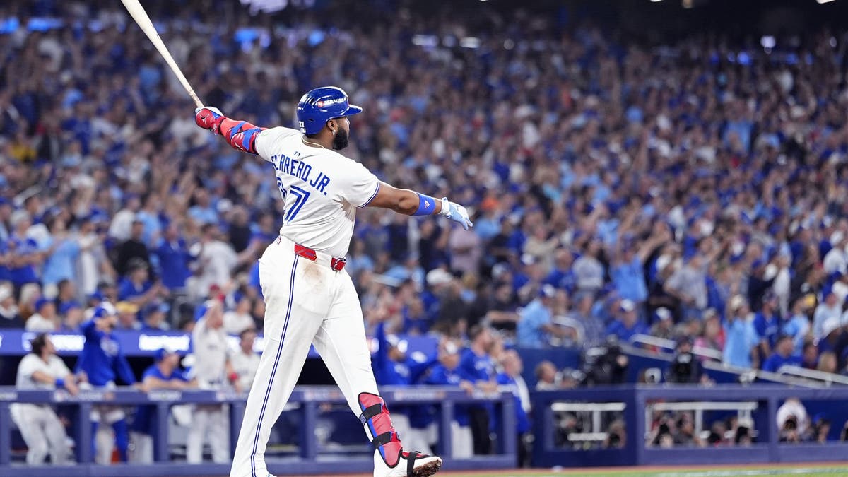 Vladimir Guerrero Jr. led the American League in home runs, runs scored, on-base percentage, slugging percentage and OPS+ in 2021. (Photo by Mark Blinch/Getty Images)