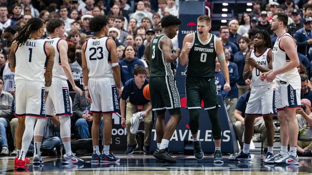 Cam Ward #3 and Jaxon Kohler #0 of the Michigan State Spartans react during the second half of an NCAA men's basketball exhibition. (Photo by Joe Buglewicz/Getty Images)