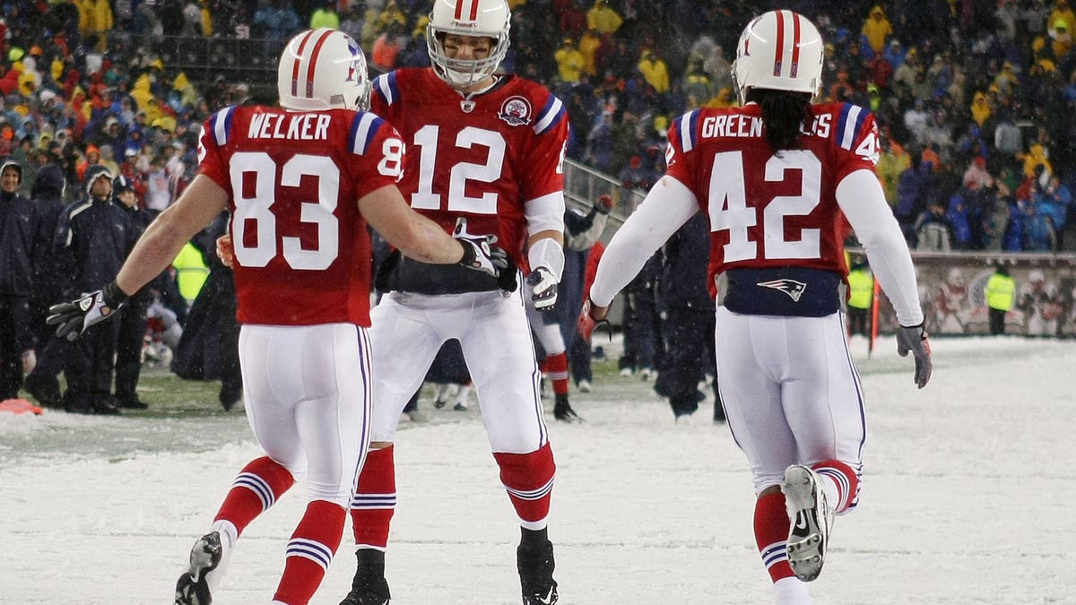Tom Brady arguably had the greatest quarter in NFL history in the Patriots' victory over the Titans in October 2009, throwing five touchdown passes in the frame. (Photo by Elsa/Getty Images)