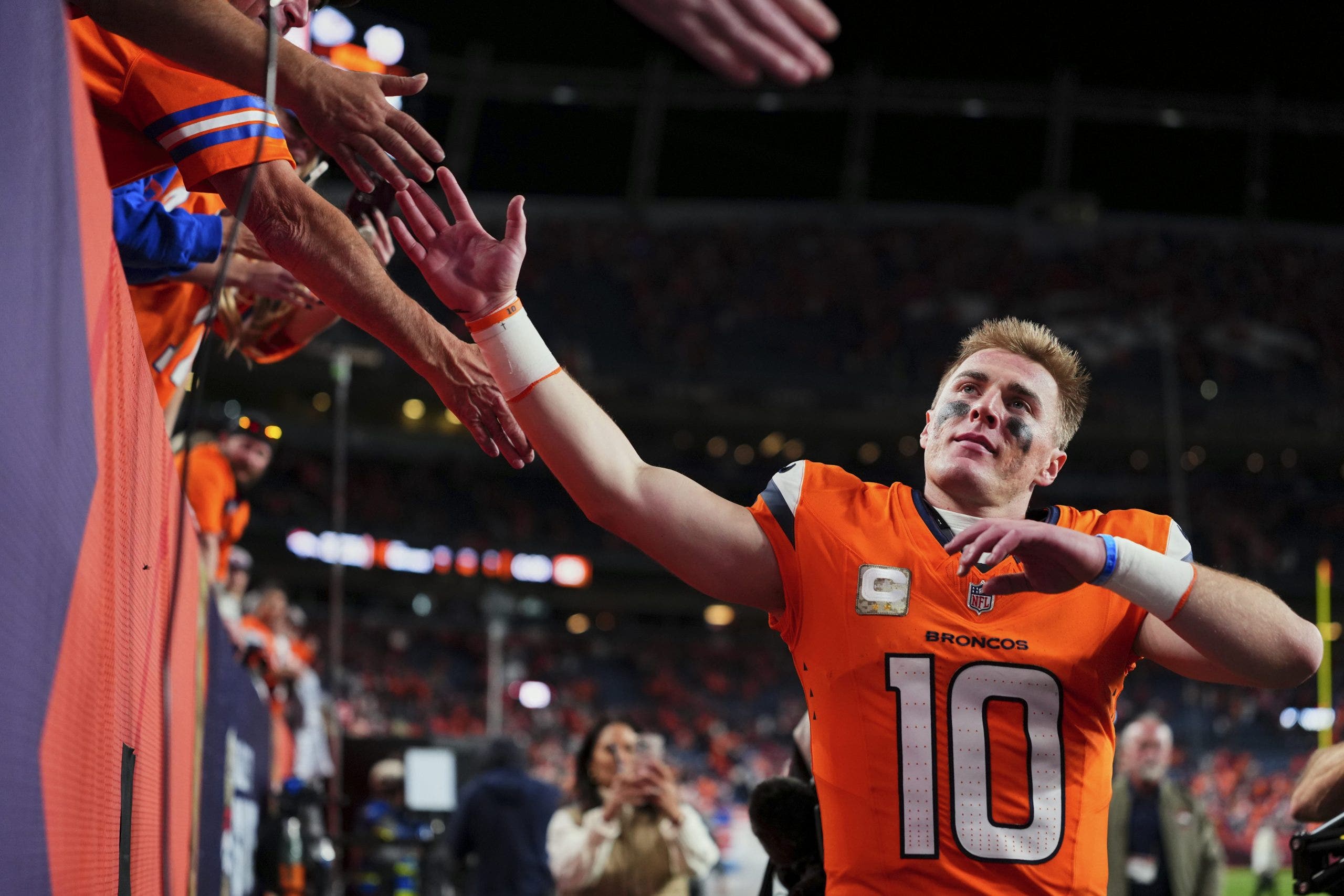Bo Nix and the Broncos are in the driver's seat in the AFC West race. (Photo by Cooper Neill/Getty Images)