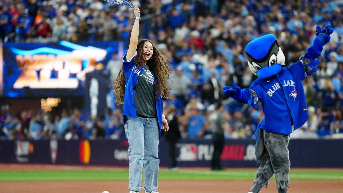 TORONTO, ON - OCTOBER 25:  Boys and Girls Clubs of America national youth of the year for 2025-2026 Ximena delivers the game ball prior to Game Two of the 2025 World Series presented by Capital One between the Los Angeles Dodgers and the Toronto Blue Jays at Rogers Centre on Saturday, October 25, 2025 in Toronto, Ontario, Canada. (Photo by Mary DeCicco/MLB Photos via Getty Images)