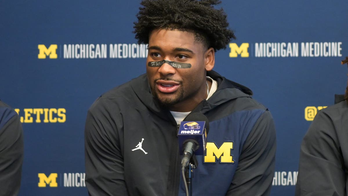 Michigan running back Justice Haynes speaks to the media during the postgame press conference after a game against Wisconsin. (Photo by Aaron J. Thornton/Getty Images)