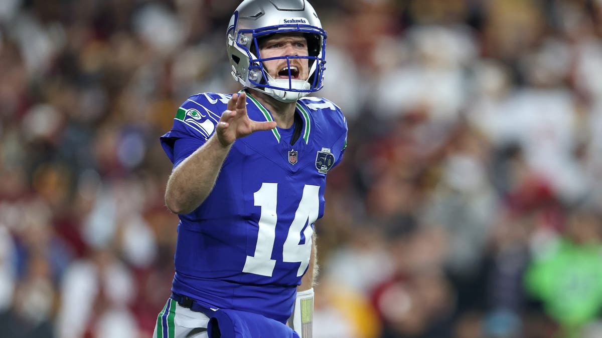 Sam Darnold had a perfect first half against the Commanders on Sunday, throwing four touchdowns and zero incompletions. (Photo by Scott Taetsch/Getty Images)