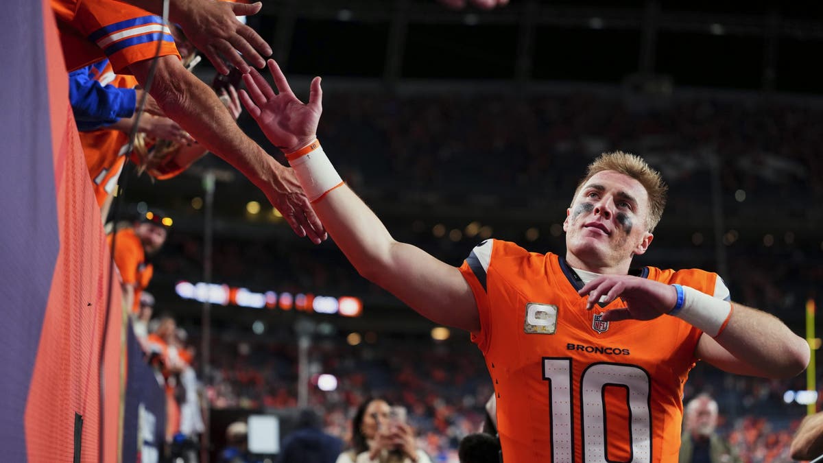 Bo Nix and the Broncos are in the driver's seat in the AFC West race. (Photo by Cooper Neill/Getty Images)