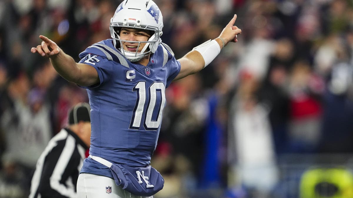 Drake Maye leads the league in passing yards and has the Patriots at 9-2. (Photo by Cooper Neill/Getty Images)
