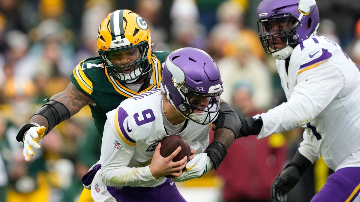 J.J. McCarthy was sacked five times and threw for only 87 yards last week against the Packers. (Patrick McDermott/Getty Images)