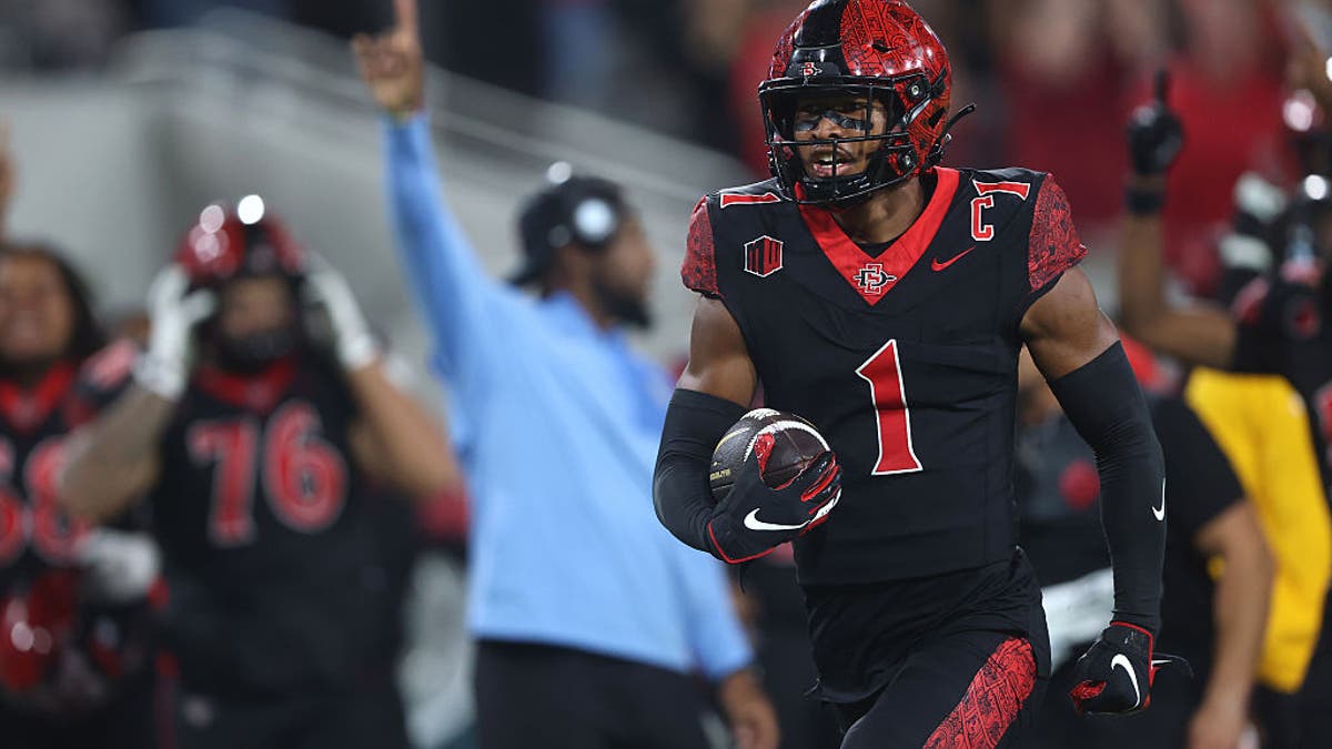 Chris Johnson #1 of the San Diego State Aztecs reacts as he returns an interception for a touchdown during the second half of a game against the California Golden Bears at Snapdragon Stadium on September 20, 2025 in San Diego, California.  (Photo by Sean M. Haffey/Getty Images)
