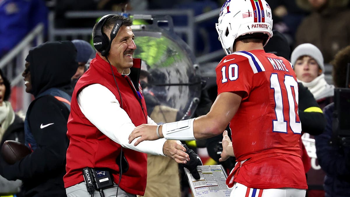It's all smiles for head coach Mike Vrabel and Drake Maye in New England. (Winslow Townson/Getty Images)