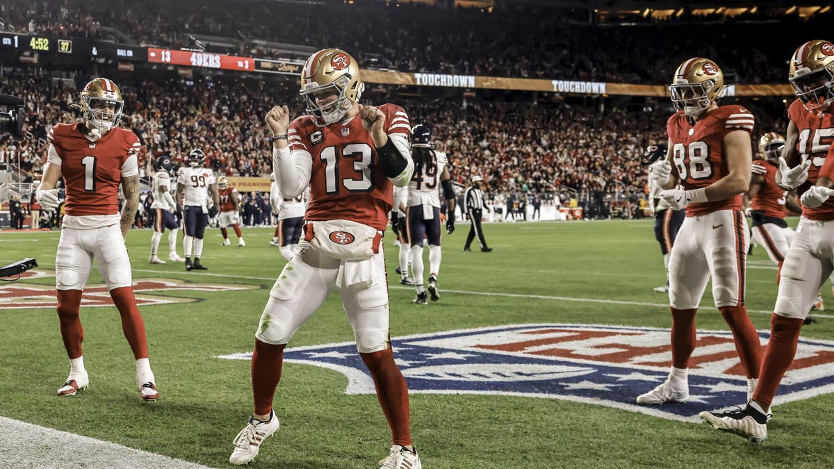 Brock Purdy threw for three touchdowns, rushed for two and hit the dougie in the 49ers' win over the Bears. (Photo by Carlos Avila Gonzalez/San Francisco Chronicle via Getty Images)