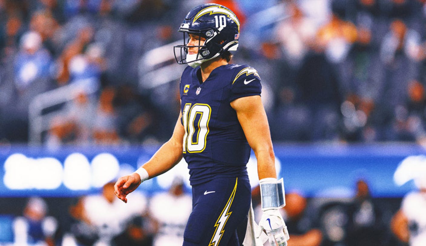 Justin Herbert dropping back to pass in an NFL game