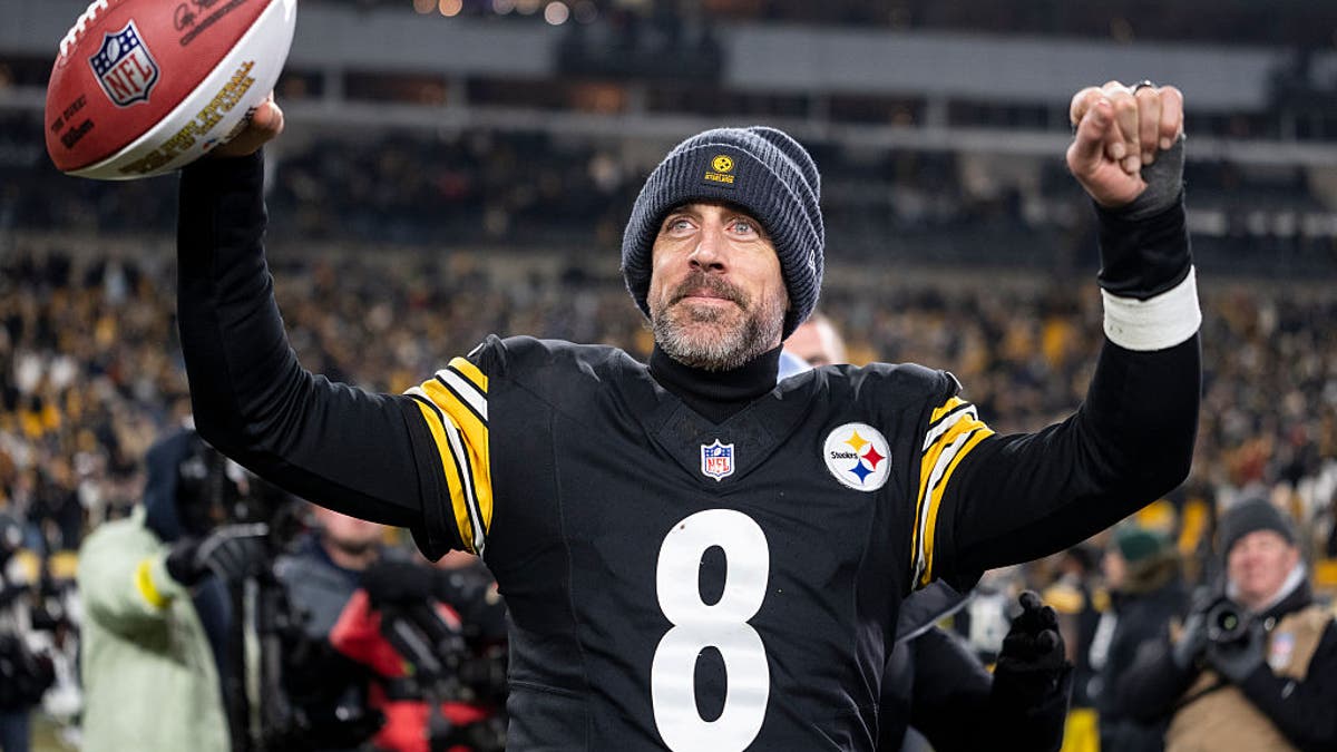 Aaron Rodgers celebrates following the Steelers' win over the Ravens in Week 18 to take the AFC North and advance to the playoffs. (Photo by Michael Owens/Getty Images)