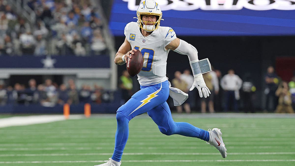 Justin Herbert has overcome a flawed roster all season. Now the challenge is doing it in the postseason. (Photo by Stacy Revere/Getty Images)