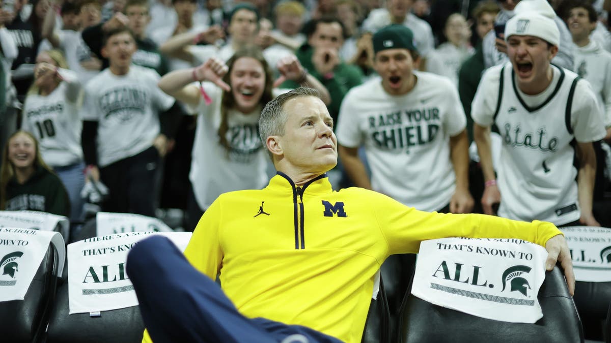 Head coach Dusty May of the Michigan Wolverines looks on during warmups before a game against Michigan State. (Photo by Rey Del Rio/Getty Images)