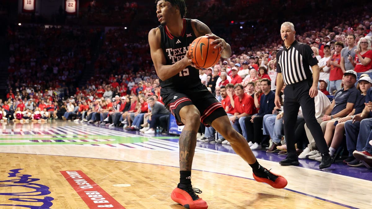 TUCSON, ARIZONA - FEBRUARY 14: JT Toppin #15 of the Texas Tech Red Raiders controls the ball during the second half against the Arizona Wildcats at McKale Center at ALKEME Arena on February 14, 2026 in Tucson, Arizona. The Red Raiders defeated the Wildcats 78-75 in overtime. (Photo by Chris Coduto/Getty Images)