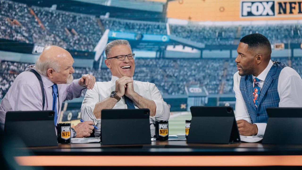 Howie Long sharing a laugh with Bradshaw and Strahan
