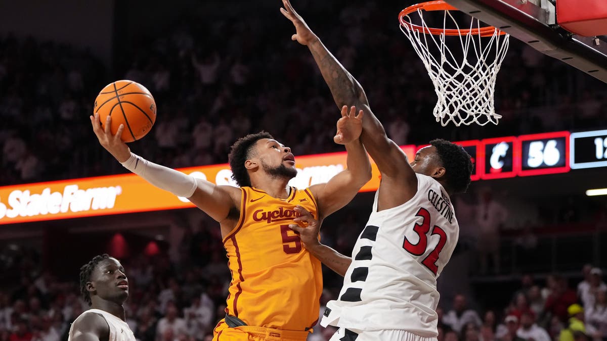 Joshua Jefferson #5 of the Iowa State Cyclones attempts a shot as he is guarded by Jalen Celestine #32 of Cincinnati. (Photo by Dylan Buell/Getty Images)