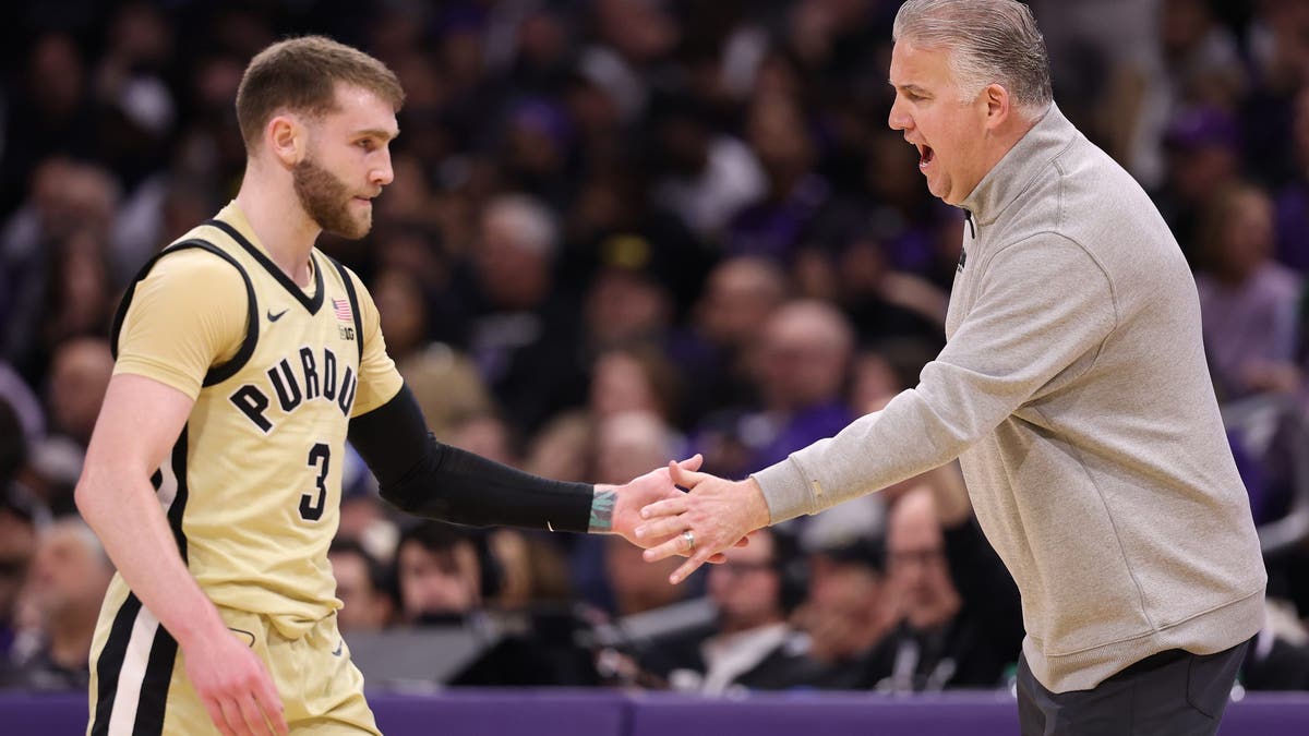 Purdue head coach Matt Painter high-fives Braden Smith against the Northwestern Wildcats. (Photo by Michael Reaves/Getty Images)