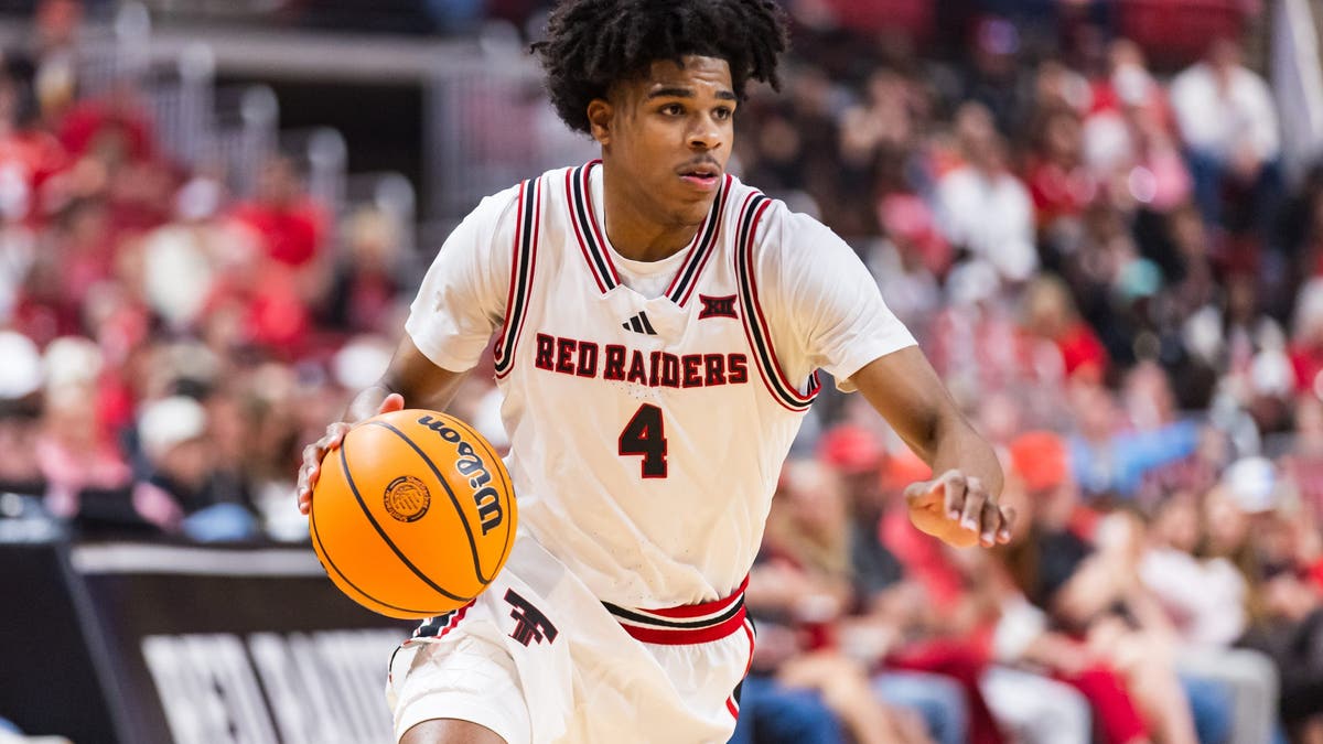 Christian Anderson #4 of the Texas Tech Red Raiders handles the ball during the first half of a game against TCU. (Photo by John E. Moore III/Getty Images)
