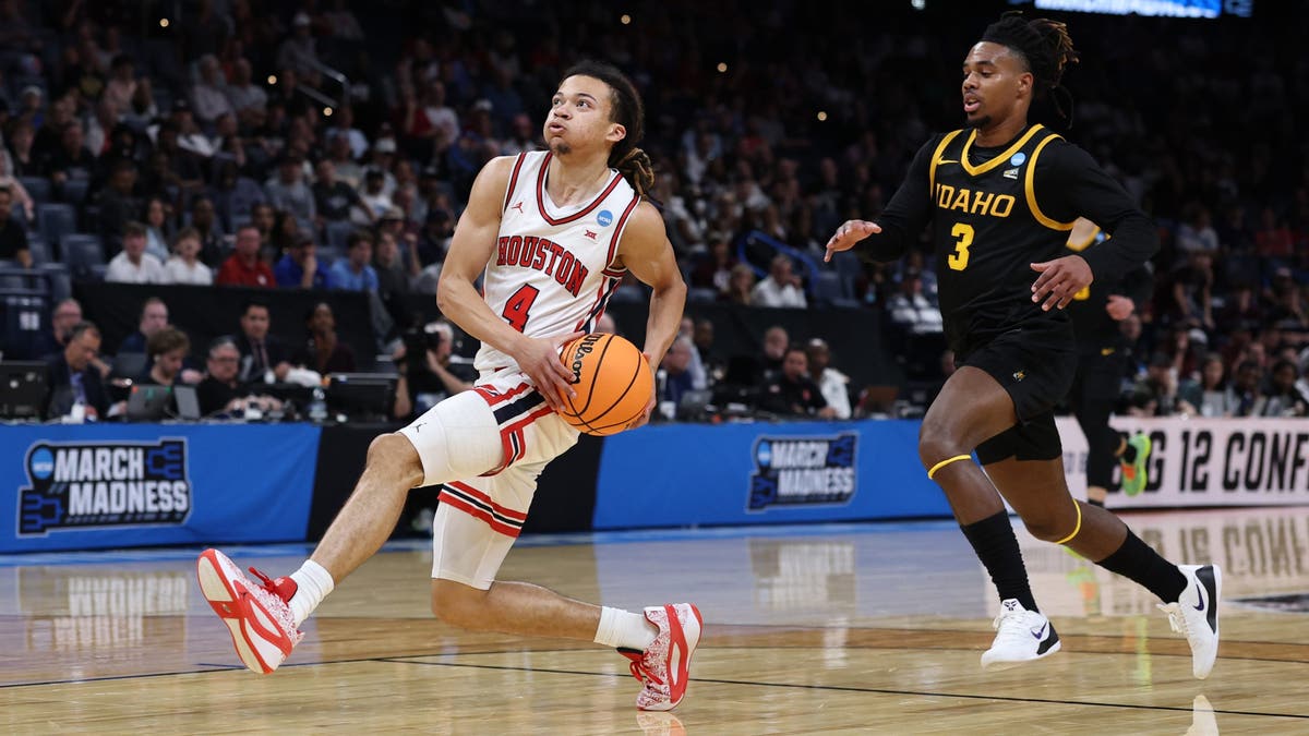 Kingston Flemings #4 of the Houston Cougars drives to the basket past Biko Johnson #3 of the Idaho Vandals. (Photo by Stacy Revere/Getty Images)