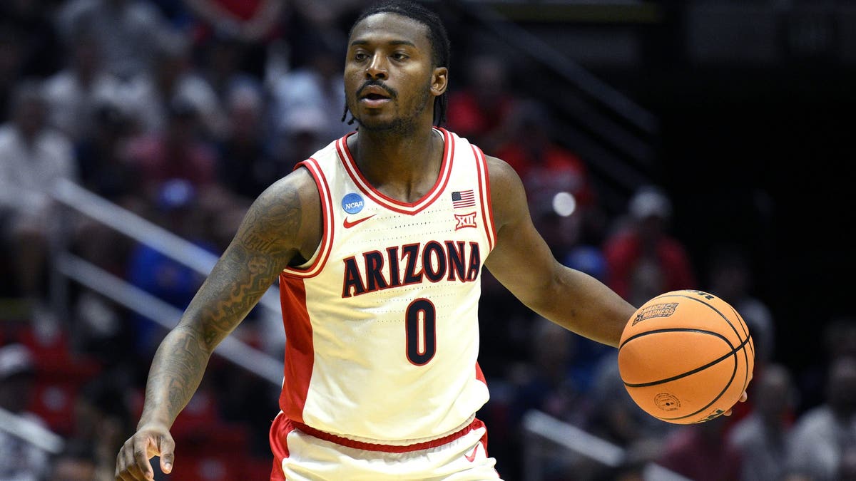 Jaden Bradley #0 of the Arizona Wildcats dribbles during the first half against Long Island University. (Photo by Orlando Ramirez/Getty Images)