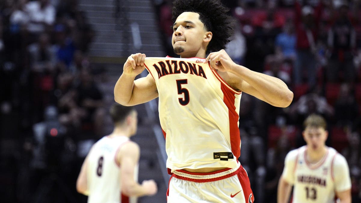 Brayden Burries #5 of the Arizona Wildcats celebrates during the second half against Utah State. (Photo by Orlando Ramirez/Getty Images)