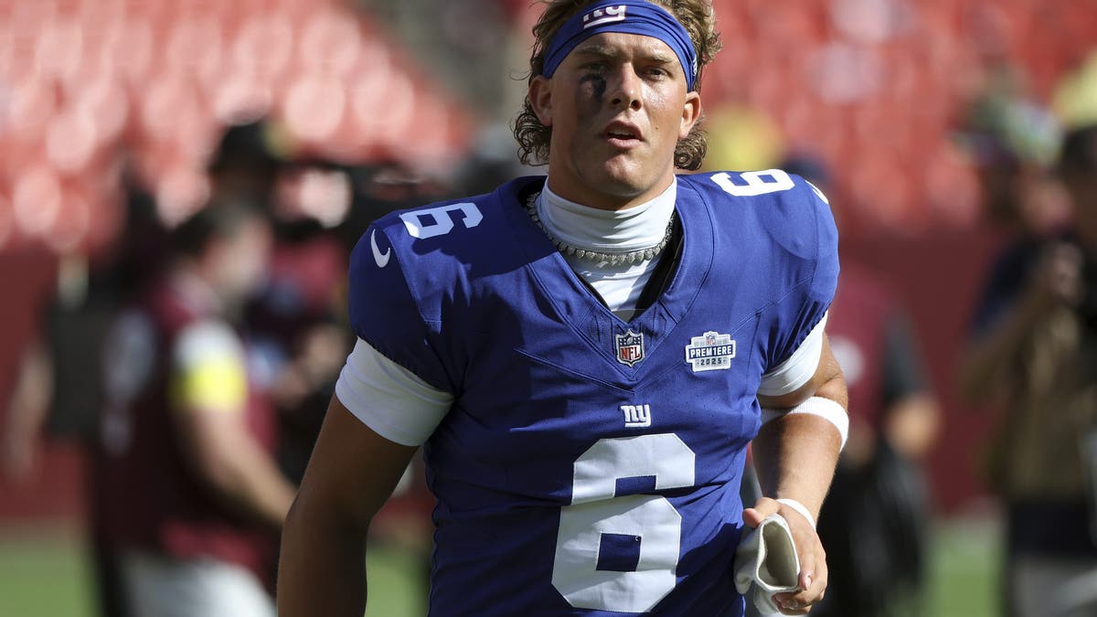 The "Rookie PREM1ERE" patch on Jaxson Dart's jersey will be featured on one of his Topps trading cards. (Image via Topps/Fanatics)