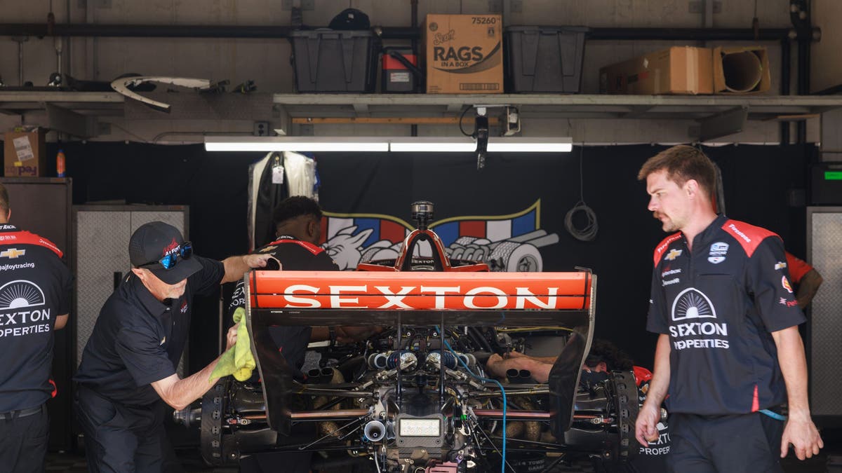 Crew members work on Santino Ferrucci's engine in 2025. (Photo by Jeremy Hogan/SOPA Images/LightRocket via Getty Images)