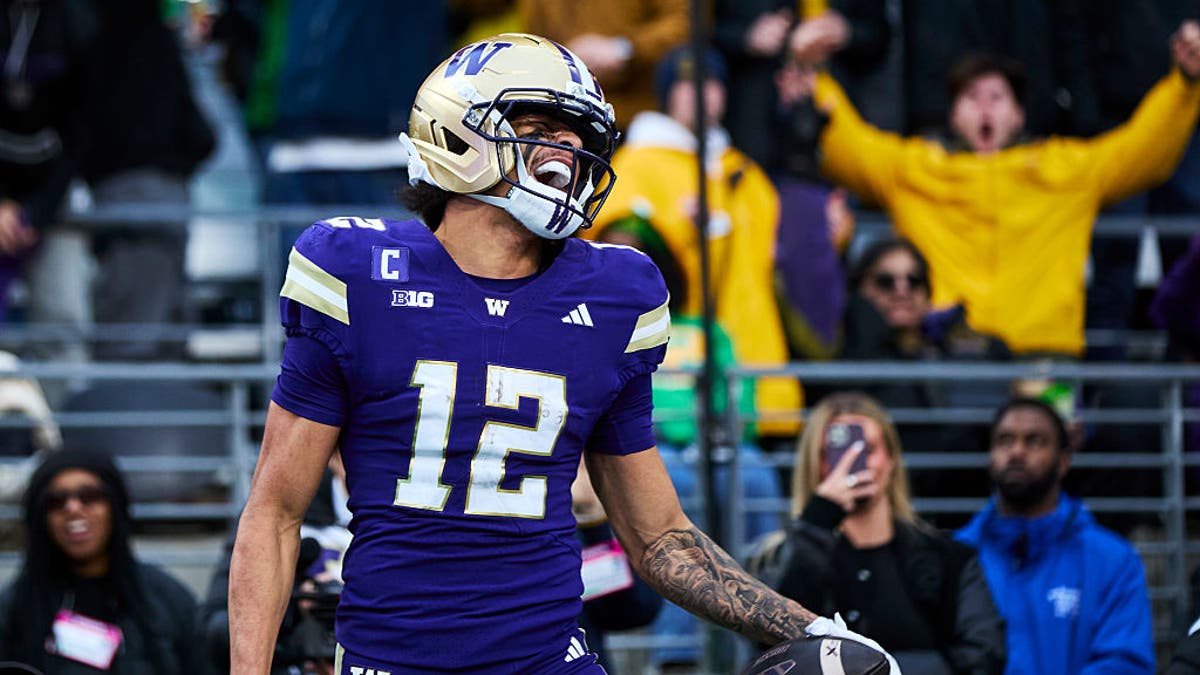 Denzel Boston celebrates after scoring a fourth-quarter touchdown against the Oregon Ducks at Husky Stadium in November. (Photo by Blake Dahlin/ISI Photos/ISI Photos via Getty Images)