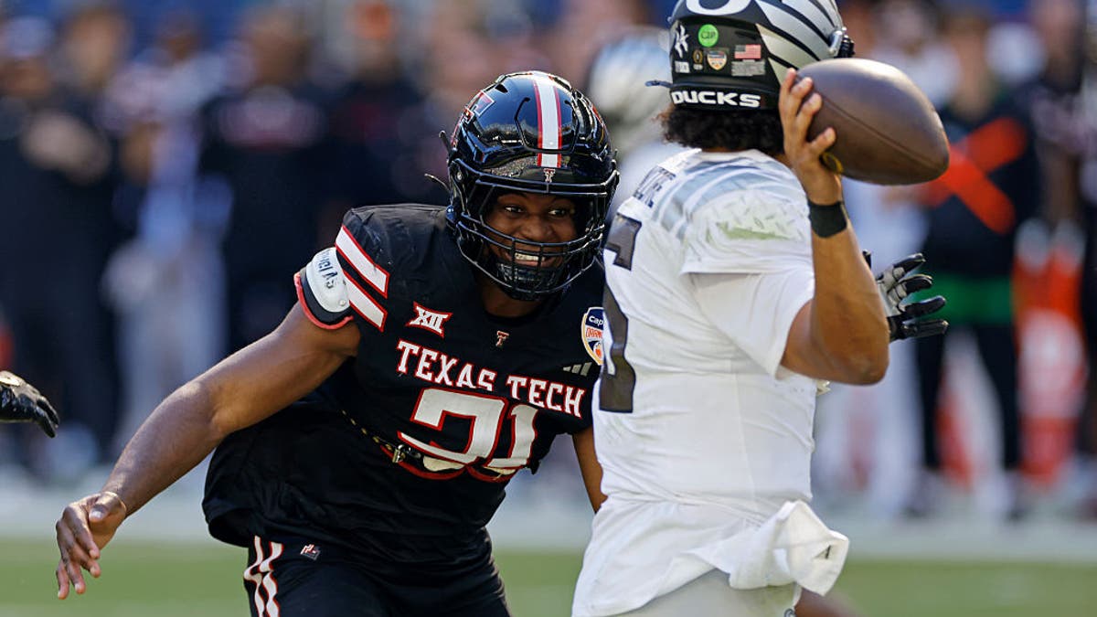 David Bailey closes in on Oregon QB Dante Moore during the College Football Playoff quarterfinal in January. In the game, Bailey had nine tackles, one sack, two tackles for loss and two passes defensed. (Photo by Joe Robbins/Icon Sportswire via Getty Images)