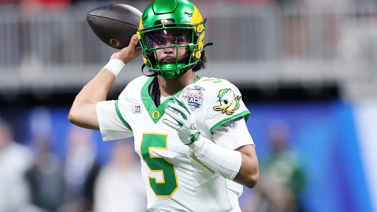 Dante Moore threw for 3,565 yards, 30 touchdowns and 10 interceptions last season. (Photo by Kevin C. Cox/Getty Images)