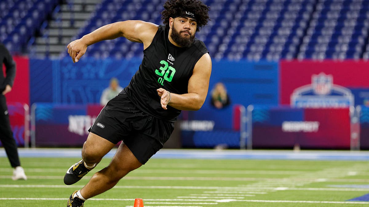 Vega Ioane's physicality fits the Ravens' style of play on the offensive line. (Photo by Lauren Leigh Bacho/Getty Images)