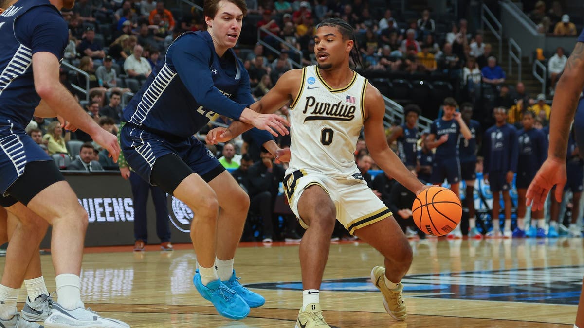 C.J. Cox goes up against the Queens University Royals during the 2026 NCAA Men's Basketball Tournament. (Photo by Dilip Vishwanat/NCAA Photos via Getty Images)