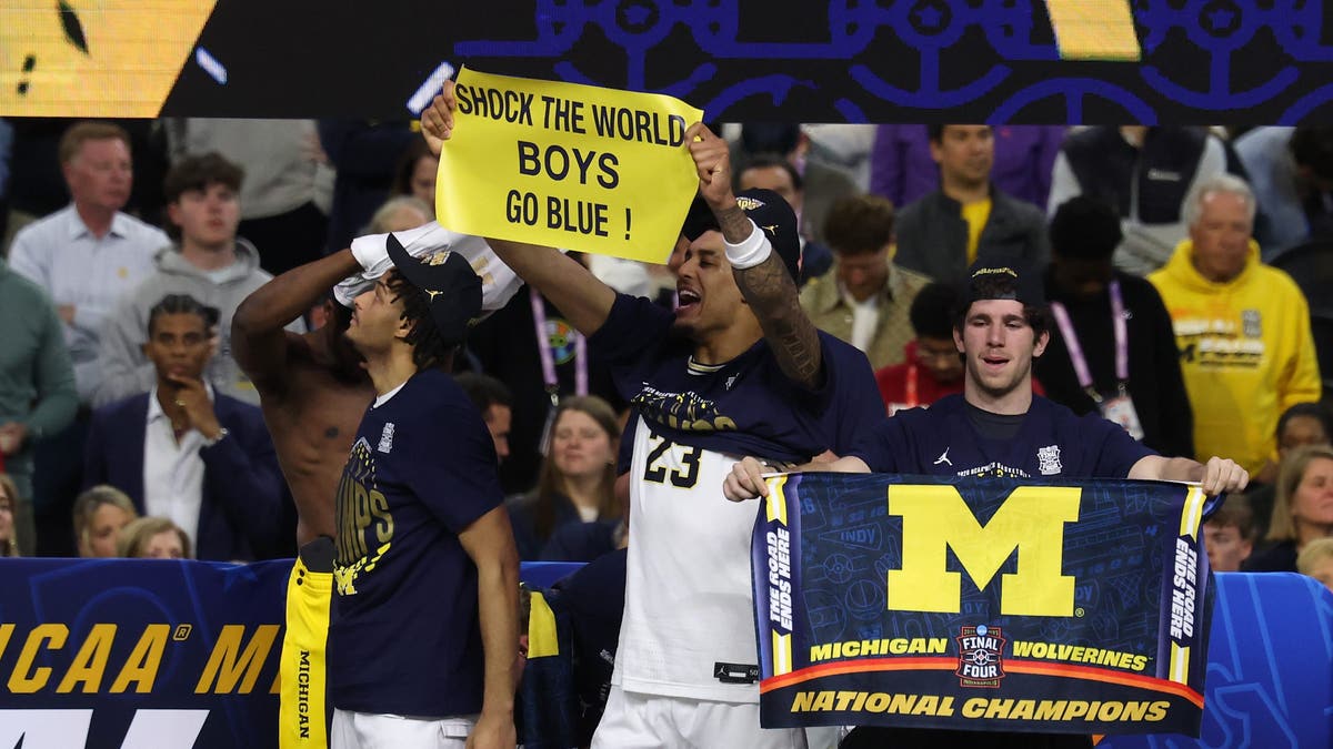 The Michigan Wolverines celebrate after defeating the UConn Huskies 69-63 in the national championship. (Photo by Andy Lyons/Getty Images)