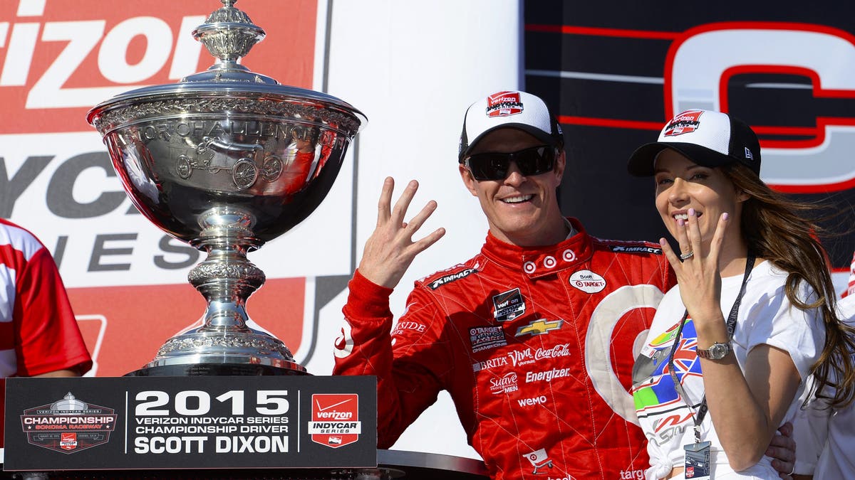 Scott Dixon with his wife, Emma, after winning the 2015 INDYCAR championship. (Photo by Robert Laberge/Getty Images)
