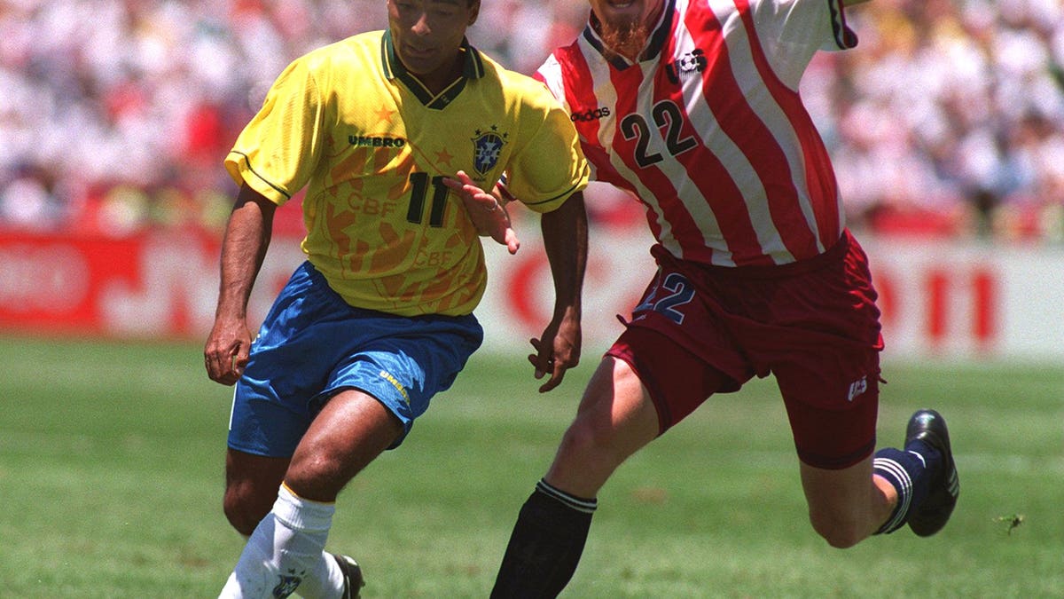 USA's Alexi Lalas keeping up with Brazil's Romario. (Photo Credit: Chris Cole/ALLSPORT)