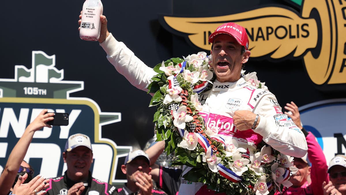 Helio Castroneves of Brazil added a hint of color to his milk bottle back in 2021. 