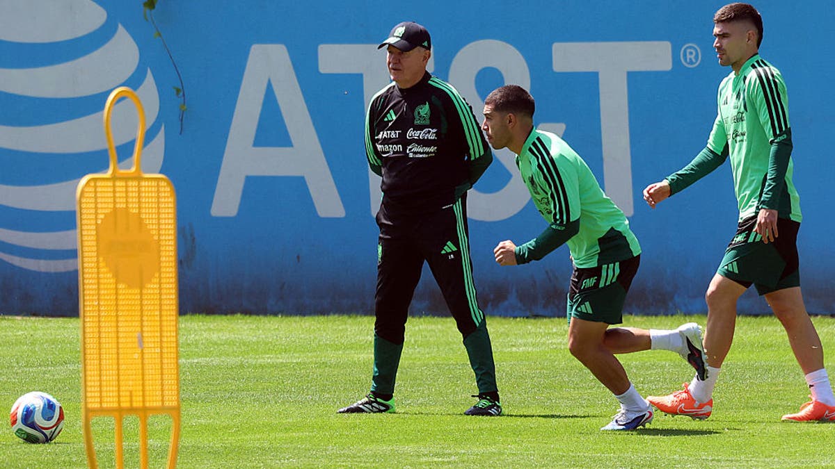 Mexico's midfielder Erik Lira (C) and defender Johan Vasquez (R) instrumentality portion successful a grooming league with caput manager Javier Aguirre up of their affable lucifer against the Portuguese nationalist squad successful Mexico City connected March 26, 2026. Mexico volition play a affable lucifer against Portugal connected March 28 astatine the Banorte Stadium (formerly known arsenic Azteca Stadium) successful Mexico City. (Photo by Luis CORTES / AFP via Getty Images)