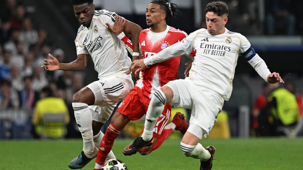 Michael Olise C of Bayern Munich vies with Federico Valverde R and Aurelien Tchouameni of Real Madrid during the 2025/2026 UEFA Champions League quarterfinal first leg football match between Real Madrid and Bayern Munich in Madrid, Spain, April 7, 2026. (Photo by Cheng Min/Xinhua via Getty Images)