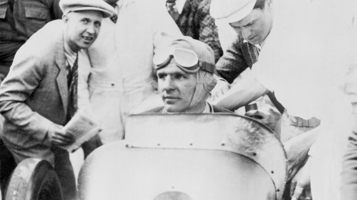 Louis Meyer, a 23-year-old Californian, in his Miller Special after winning the 16th annual 500 mile auto race at the Indianapolis Speedway. 