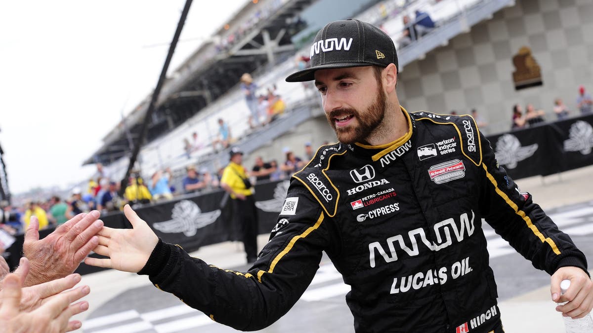 Me, high-fiving fans at Indianapolis Motor Speedway in 2018. (Photo by Michael Allio/Icon Sportswire via Getty Images)