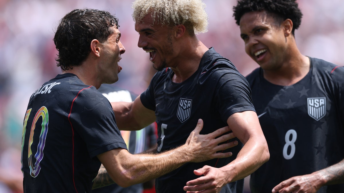 Christian Pulisic (left), Antonee Robinson (center) and Weston McKennie will be key players for the United States this summer. (Jamie Squire/Getty Images)