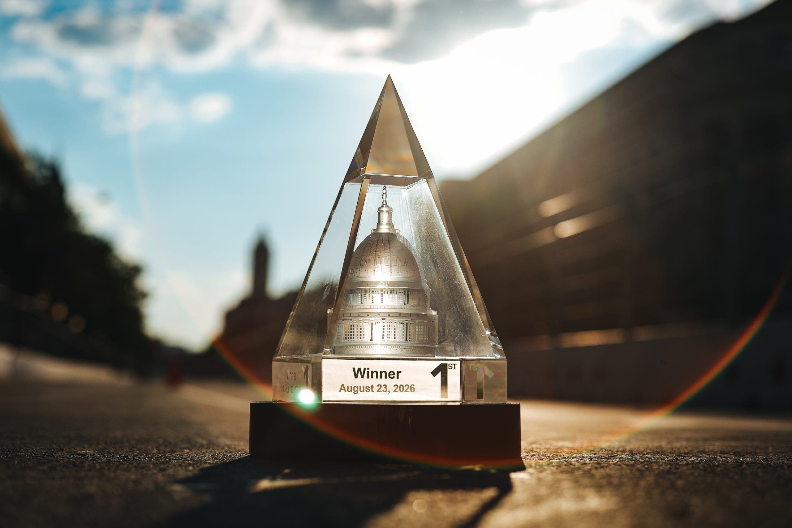 The Freedom 250 owner trophy features a solid clear crystal pyramid mathematically proportioned to match the exact 72.6-degree slope of the Washington Monument. (Photo courtesy of INDYCAR.)
