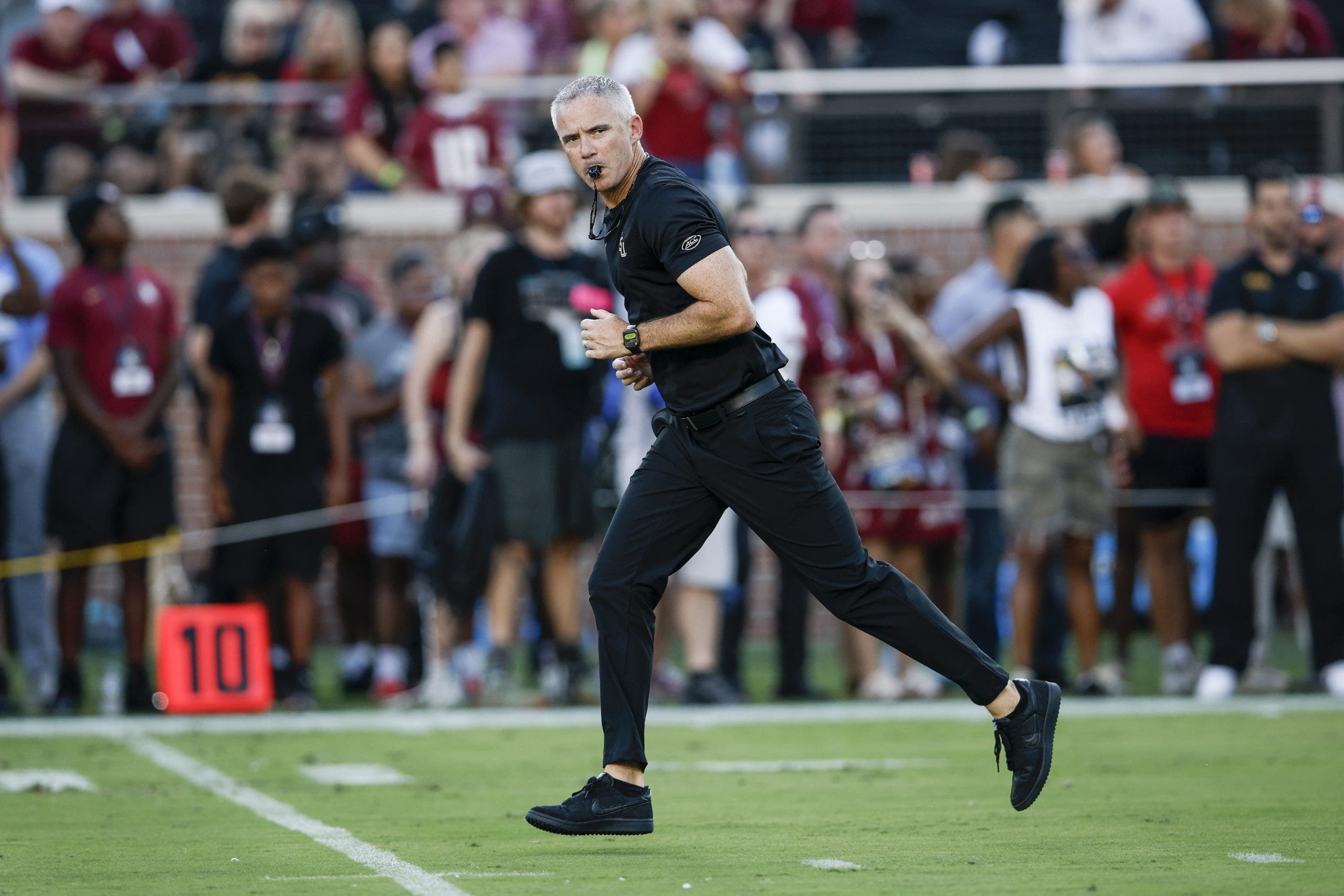 Florida State head coach Mike Norvell takes the field ahead of the Seminoles' matchup against No. 19 SMU, which was delayed nearly two hours. (Photo by Don Juan Moore/Getty Images)
